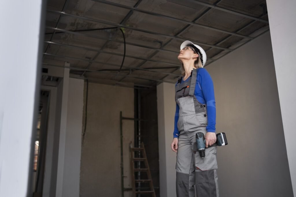 Reusable WPC and acoustic wall panels being removed and reinstalled in a modern home interior